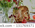 Red decorative vase in the shape of a pomegranate. Wedding table d cor. Gold and white 131769371