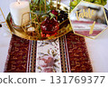 Red decorative vase in the shape of a pomegranate. Wedding table d cor. Gold and white 131769377