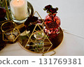 Red decorative vase in the shape of a pomegranate. Wedding table d cor. Gold and white 131769381