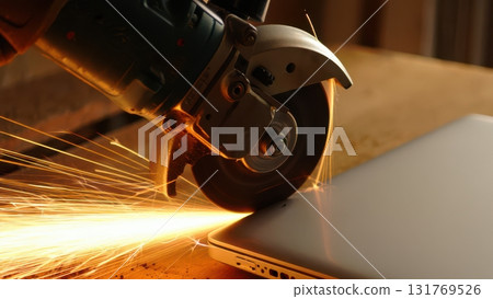 Angle grinder destroying laptop for data destruction concept 131769526