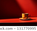Minimalist image of red table with a cup of coffee on dark background 131770995