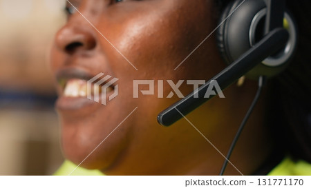 Call center clerk parcel tracking and order dispatch on help line, working in an online shopping logistics center. Worker resolving cargo issues and packages lost in distribution process. Camera B. Call center clerk parcel tracking and order dispatch on help line, working in an online shopping logistics center. Worker resolving cargo issues and packages lost in distribution process. Camera B. 131771170