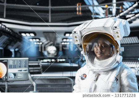 Portrait of cosmonaut preparing for planetary mission outside, seeking extraterrestrial life. Woman in orbital station begins landing procedures on solar system planet to advance scientific knowledge Portrait of cosmonaut preparing for planetary mission outside, seeking extraterrestrial life. Woman in orbital station begins landing procedures on solar system planet to advance scientific knowledge 131771228