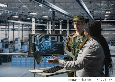 Army tech expert in data center briefing command officer with AI assisted strategic insights. Server farm workers analyzing enemy movement predictions generated by AI systems Army tech expert in data center briefing command officer with AI assisted strategic insights. Server farm workers analyzing enemy movement predictions generated by AI systems 131771256