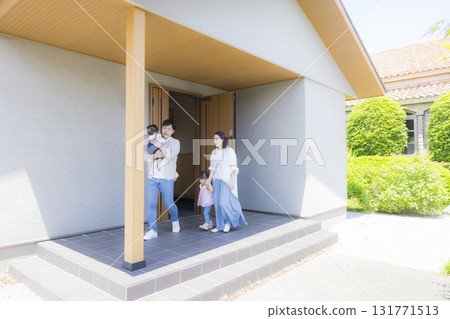 Family at the entrance going out Family at the entrance going out 131771513