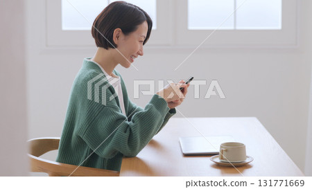 A woman watching a smartphone 131771669