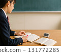 Over-the-shoulder scene of studying for exams (high school girl/notebook and timer) 131772285