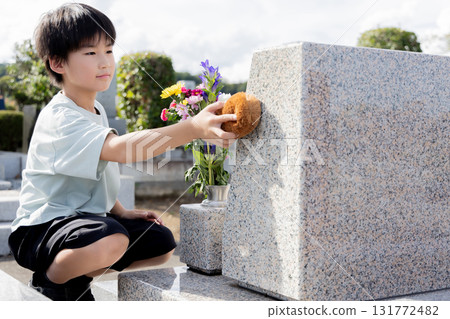 A child washing the graves of his ancestors 131772482