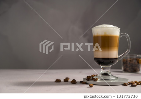 Layered coffee latte drinks. Hot coffee drinks in glass mugs, copy space Layered coffee latte drinks. Hot coffee drinks in glass mugs, copy space 131772730