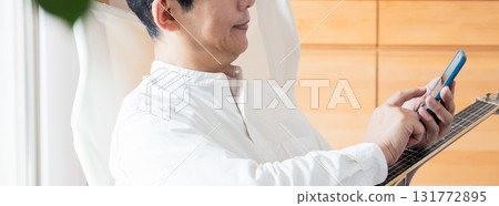 Male man who operates a smartphone 131772895