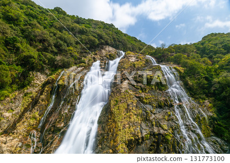Fresh greenery and blue skies at Oko Falls, one of Japan's top 100 waterfalls, Yakushima National Park 131773100