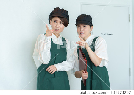 Part-time staff having a secret conversation 131773207