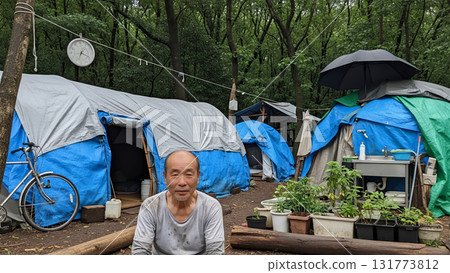 A homeless man living in a blue tarp house A homeless man living in a blue tarp house 131773812