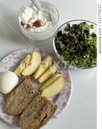 A delightful brunch spread featuring a mix of savory and sweet bites perfectly toasted bread, fresh fruits, soft scrambled eggs, and a refreshing drink to brighten your late morning. A delightful brunch spread featuring a mix of savory and sweet bites perfectly toasted bread, fresh fruits, soft scrambled eggs, and a refreshing drink to brighten your late morning. 131774017