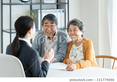 Senior couple consulting with a planner 131774098