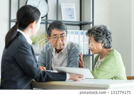 Senior couple consulting with a planner Senior couple consulting with a planner 131774175