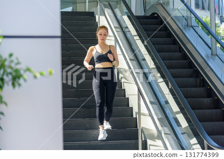 Stretch routine for sport woman outdoor, fit people performs workout, running stairs for health with exercise, finding moment to stretch muscles for wellness. Stretch routine for sport woman outdoor, fit people performs workout, running stairs for health with exercise, finding moment to stretch muscles for wellness. 131774399