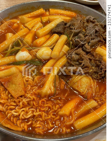 Rabokki, Korean style Stir-fried Instant Noodle : This dish is tteokbokki with ramen noodles. Tteokbokki is a spicy dish made with rice cake, vegetables, and fish cake, all stir-fried together in a go 131774741