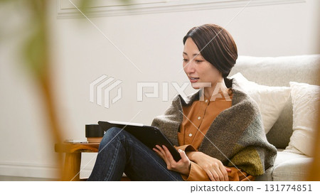 Videophone Woman operating tablet Videophone Woman operating tablet 131774851