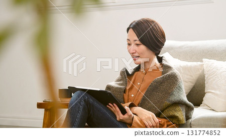 Videophone Woman operating tablet Videophone Woman operating tablet 131774852