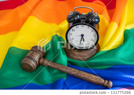 Judge's gavel and hammer on a rainbow flag.  131775266