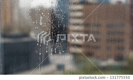 Window in soapy foam before washing. Window in soapy foam before washing. 131775550