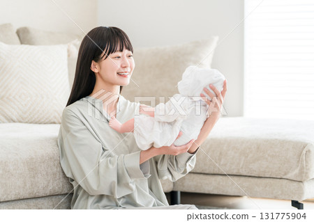 Young Asian woman holding a baby (mother, mom, childcare, parenting, childbirth) Young Asian woman holding a baby (mother, mom, childcare, parenting, childbirth) 131775904