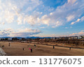 Family enjoying kite flying in the evening 131776075
