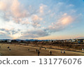 Family enjoying kite flying in the evening 131776076
