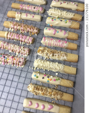 Pepero sticks coated with chocolate and sometimes topped with nuts or sprinkles. A sweet and crunchy treat, perfect for sharing or gifting on special occasions. Pepero sticks coated with chocolate and sometimes topped with nuts or sprinkles. A sweet and crunchy treat, perfect for sharing or gifting on special occasions. 131776100