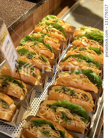 Delicious sandwich filled with fresh ingredients like crispy lettuce, juicy tomatoes, and savory meats. Perfect for a quick meal or packed lunch. Delicious sandwich filled with fresh ingredients like crispy lettuce, juicy tomatoes, and savory meats. Perfect for a quick meal or packed lunch. 131776317