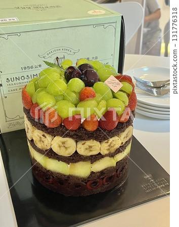 A delicious, fluffy cake with layers of rich flavor, perfect for any occasion. Often topped with frosting or fresh fruits, it's a sweet treat that brings joy to every bite. 131776318