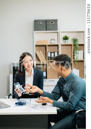 Capturing a cheerful business consultation scene with smiling professionals, perfect for illustrating corporate success, teamwork, Capturing a cheerful business consultation scene with smiling professionals, perfect for illustrating corporate success, teamwork, 131776619