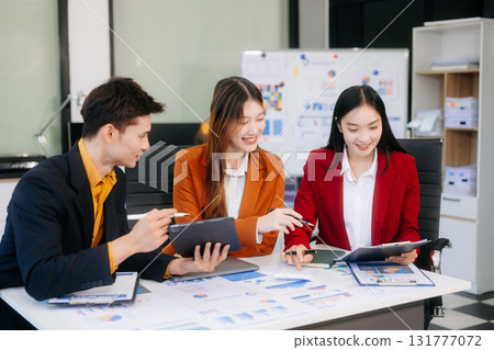 Professional teamwork as business colleagues engage in strategy, planning, and discussion 131777072