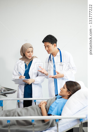 Doctors analyzing results or diagnosis of patient in clinic. Teamwork, medical and healthcare workers in discussion and research on mobile device 131777222