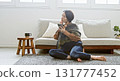 Woman operating a mobile phone 131777452