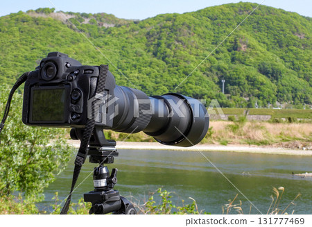 Camera with a telephoto lens Camera with a telephoto lens 131777469
