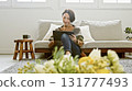 Woman operating a tablet 131777493