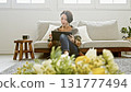 Woman operating a tablet 131777494