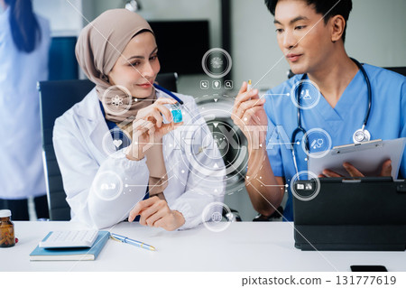 Medicine  team doctor using digital tablet and smartphone diagnose virtual electronic medical record on interface.Digital healthcare and network on virtual 131777619