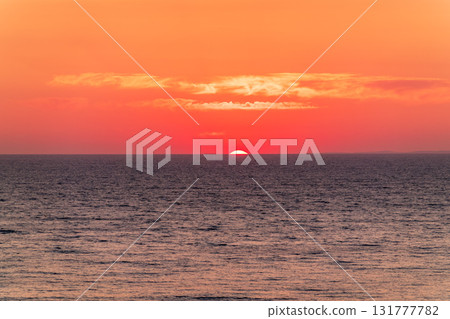 Beautiful red and orange sunrise over the sea. Beautiful red and orange sunrise over the sea. 131777782