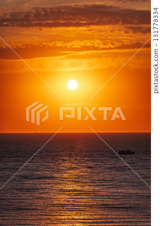 Beautiful red and orange sunrise over the sea. Beautiful red and orange sunrise over the sea. 131778334