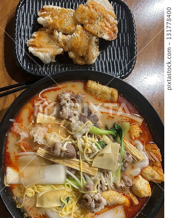 Spicy and numbing malatang with a mix of fresh ingredients in rich Sichuan broth, paired with crispy and tangy guobaorou. A perfect balance of bold heat and sweet-sour crunch for a Chinese feast. 131778400