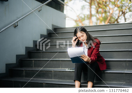 Young Asian business woman leader entrepreneur, professional manager holding digital tablet computer in big city 131778462