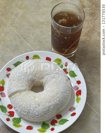A classic sugar donut with a soft, fluffy texture and coated in a sweet layer of sugar. Perfectly simple yet satisfying, offering a delightful treat with every bite. 131778530