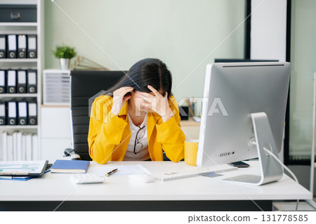 Asian business woman is stressed, bored, and overthinking from working 131778585