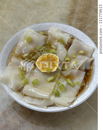 Steamed or fried Korean mandu dumplings filled with a savory mix of meat and vegetables. Crispy on the outside, tender on the inside 131778615