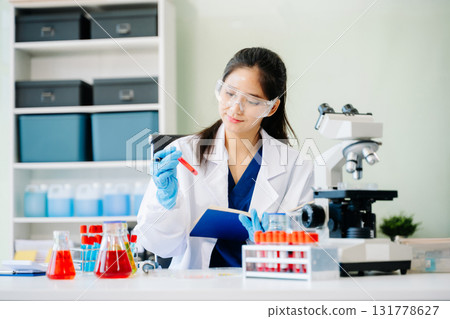 Scientists, beakers, and microscopes in cutting-edge research. Perfect for science and technology projects. Scientists, beakers, and microscopes in cutting-edge research. Perfect for science and technology projects. 131778627