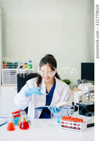 Scientists, beakers, and microscopes in cutting-edge research. Perfect for science and technology projects. Scientists, beakers, and microscopes in cutting-edge research. Perfect for science and technology projects. 131778628