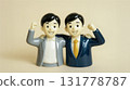 Two men with their business partners standing shoulder to shoulder, fist pump 131778787